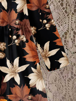 Baby dress with autumn leaves print, 100% polyester, long sleeves, black with brown and cream floral accents.