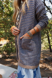 Coastal Stripe Knit Cardigan in Dusty Blue with front pockets and acrylic knit.