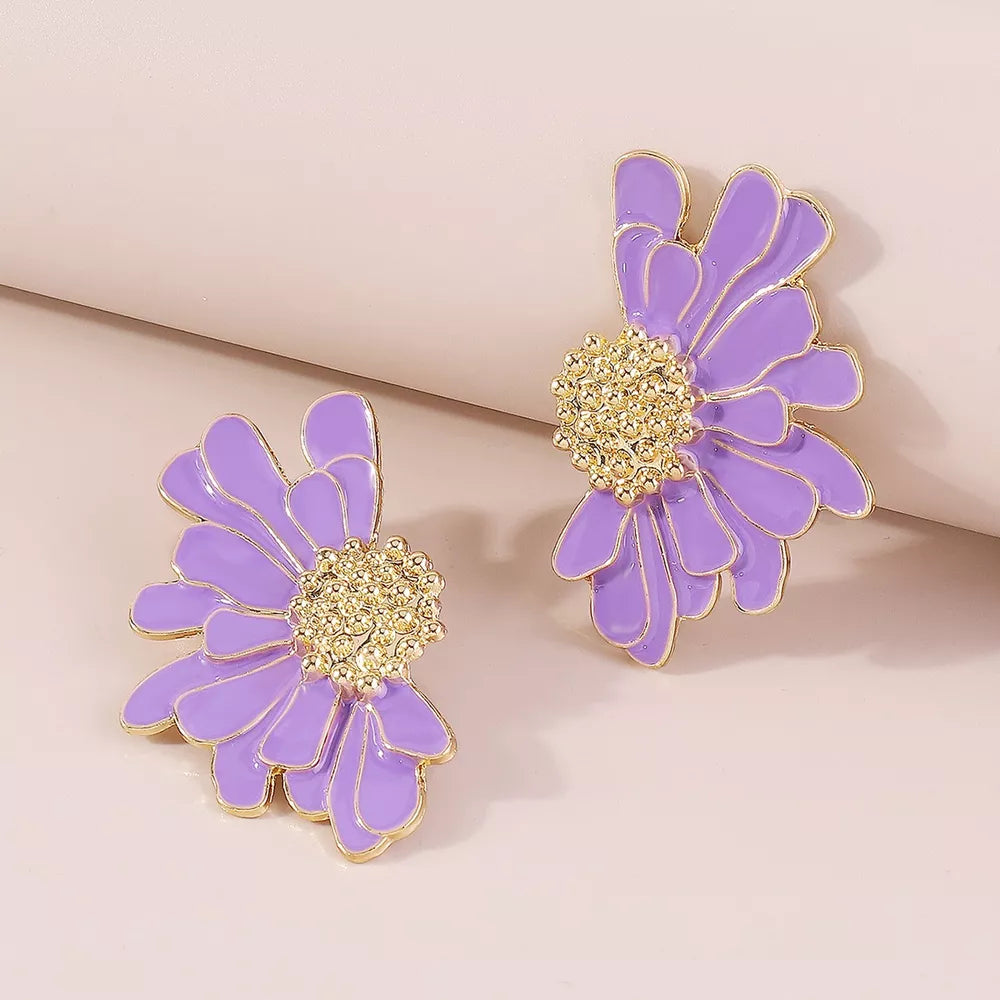 Purple flower stud earrings with textured gold center and gold trim.