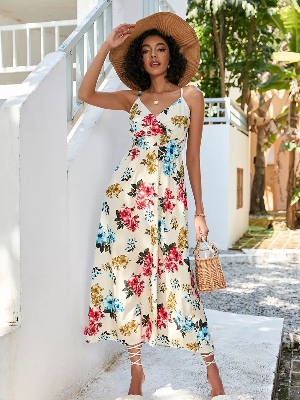 Chic floral midi dress with spaghetti straps, V-neck, and a flowy skirt.