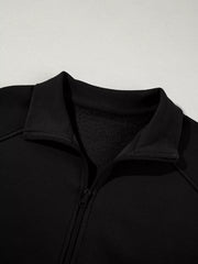 Black zip-up jacket with ribbed collar and fleece lining.