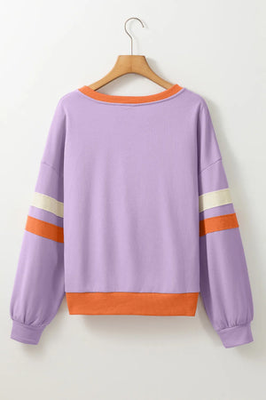 Lavender sweatshirt with orange neckline and cuffs, featuring contrast stripes on sleeves.