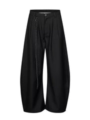 Men's black wide leg joggers with a decorative chain detail.