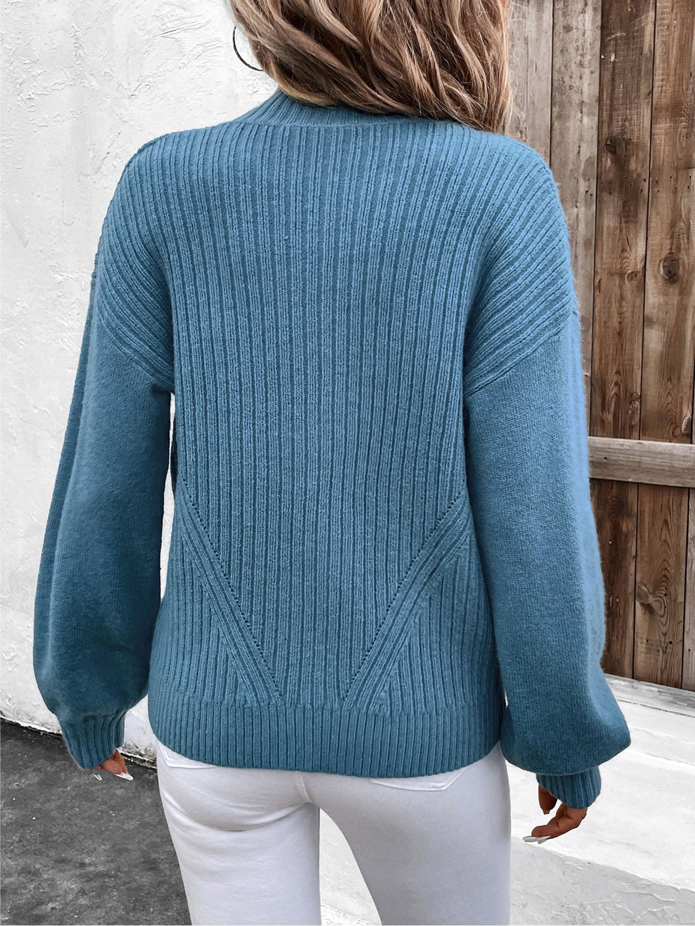 French Blue ribbed acrylic sweater with angled back detail and balloon sleeves.