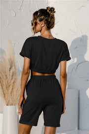 Black lounge set with rolled sleeve crop top and drawstring shorts