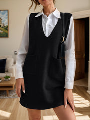 Black knit sleeveless mini dress with V-neck and patch pockets.