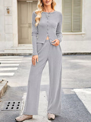 Gray button-up top with crew neck and wide-leg pants set.