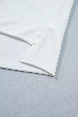 White cotton maternity tee with side slits and subtle star embellishments.