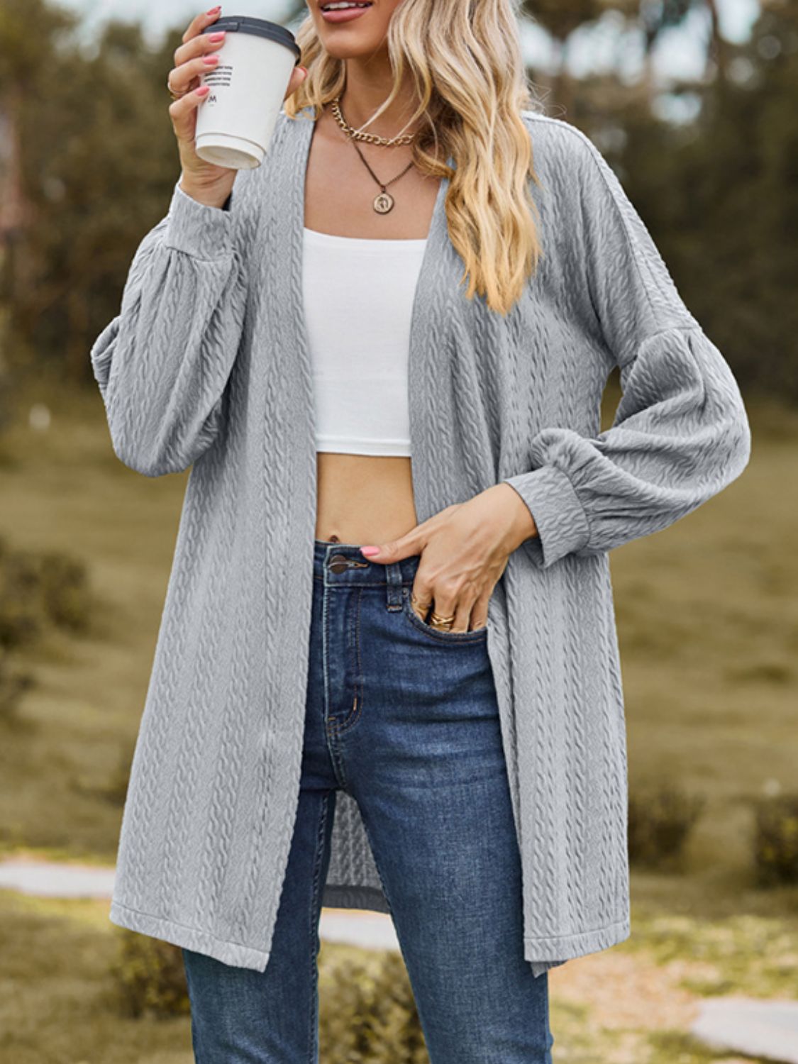Gray textured open cardigan with balloon sleeves and a relaxed fit.