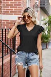 Black lace trimmed flutter sleeve blouse with V-neck and eyelet detail.