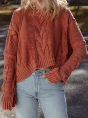 Chunky oversized cable-knit sweater in rust with a cropped fit and crew neck.