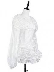 White cotton mini dress with corset waist, ruffled skirt, and voluminous sleeves.