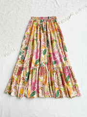 Tropical ruched maxi skirt with ruffles and a vibrant floral print.