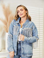 Light denim trucker jacket with star patches and silver fringe detail on shoulders and chest.