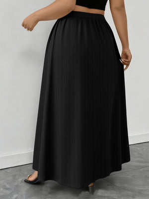 Black ribbed maxi skirt with a-line cut and pockets, shown on a model.