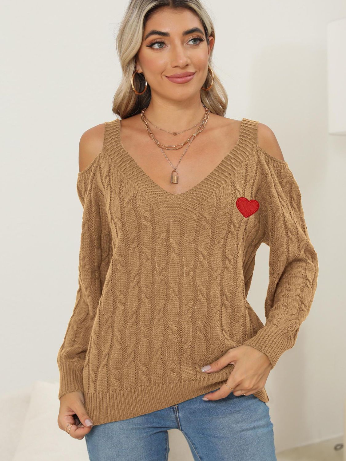 Camel open shoulder cable knit sweater with red heart detail