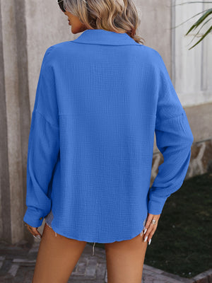 Textured cotton overshirt in royal blue with relaxed silhouette and button cuffs.