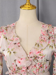 Charming ruffled floral mini dress with button front and V-neckline.