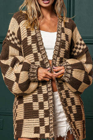 Chic checkered acrylic cardigan in tan and brown with balloon sleeves.