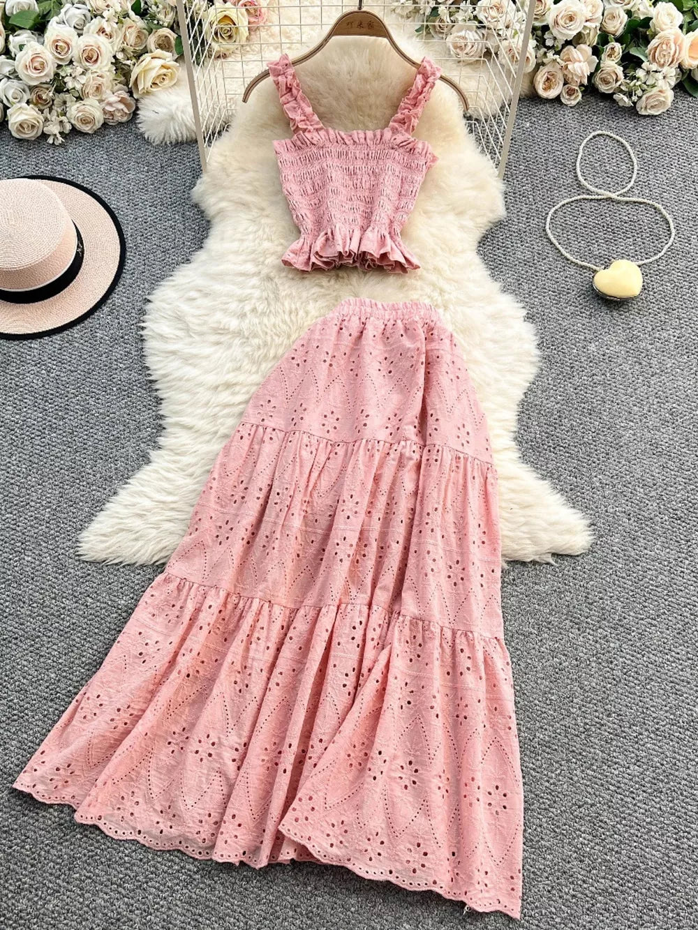 Pink ruffled crop top and eyelet maxi skirt set with elastic waistband.