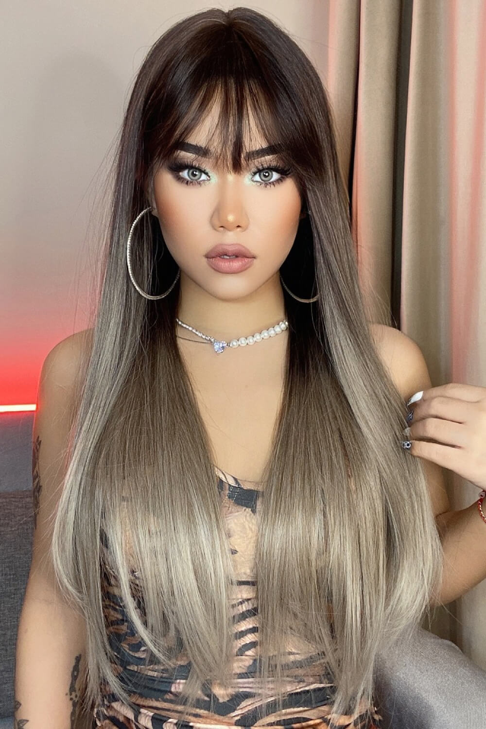 Ombre fringe synthetic hair extension in black to gray with straight cut and blunt bangs.