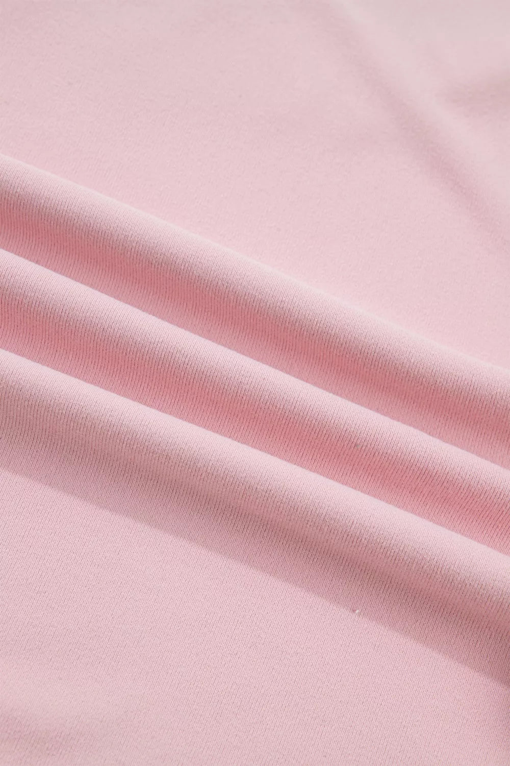 Pink maternity t-shirt with textured fabric and subtle pleats.