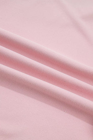 Pink maternity t-shirt with textured fabric and subtle pleats.