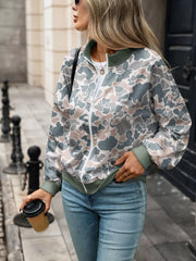 white sweatshirt featuring zipper and leaf-print