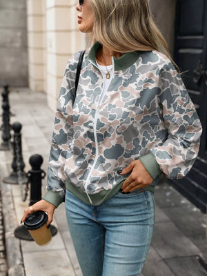 white sweatshirt featuring zipper and leaf-print