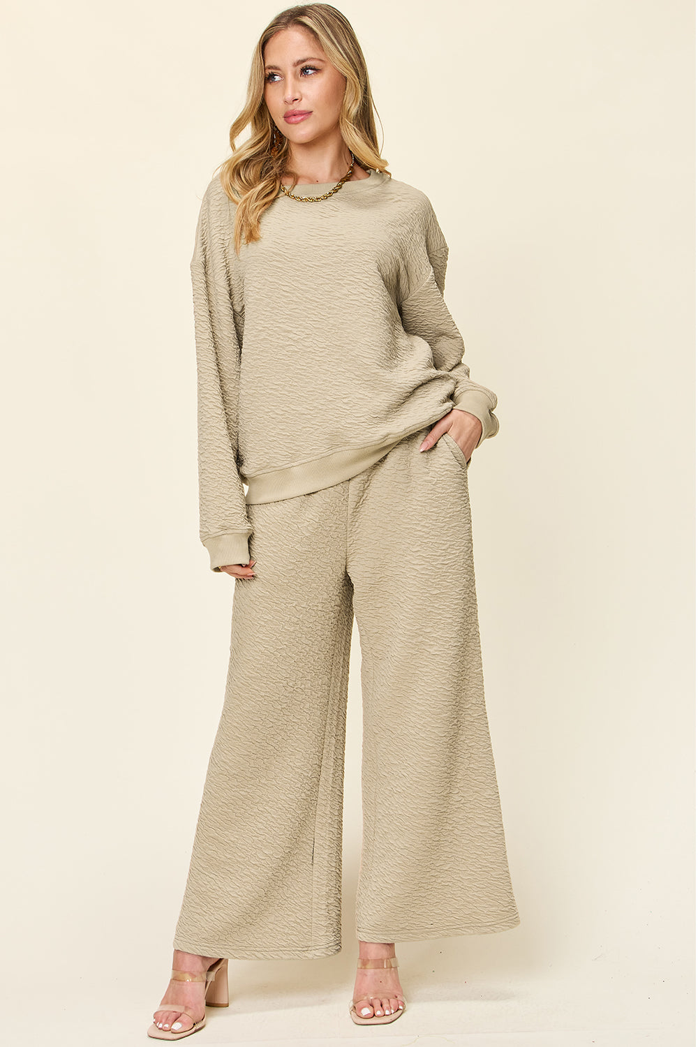 Textured lounge set in tan with crewneck sweatshirt and wide-leg pants.