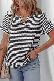 Textured knit t-shirt with notched V-neck and short sleeves in black and white stripes.