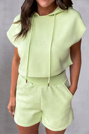 Textured light green crop hoodie and shorts set with geometric pattern