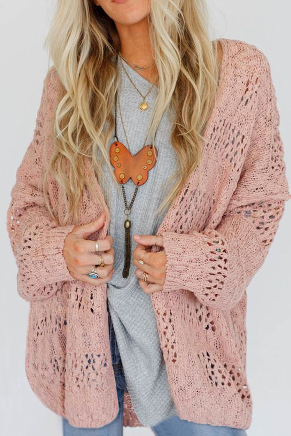 Dusty pink open-knit slouch cardigan with airy details and relaxed fit.