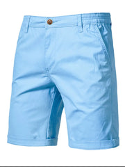 Relaxed-fit chino shorts in Pastel Blue with elastic waist and cuffed hem.