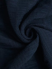 Navy ruched halter midi dress fabric with subtle texture detail.