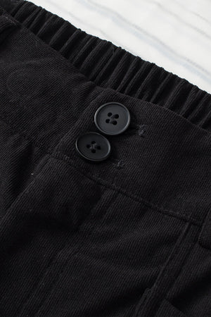 Black seamed front wide leg trousers with button detail and elastic waistband.