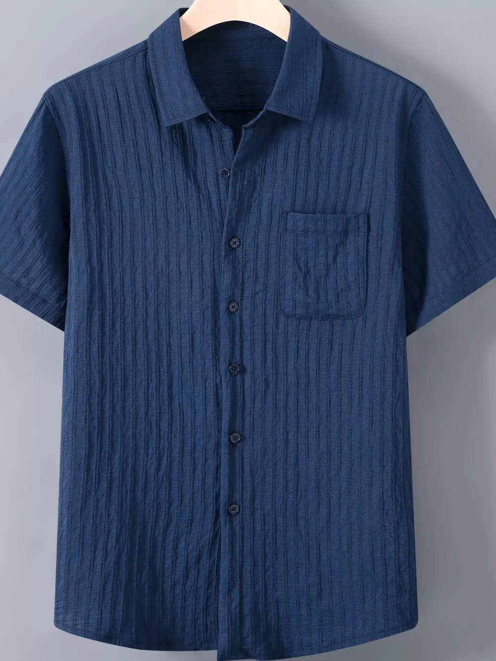 Men's royal blue textured button-up short-sleeve shirt with chest pocket.