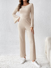 Cream ribbed knit co-ord set with bell sleeves and wide-leg pants.