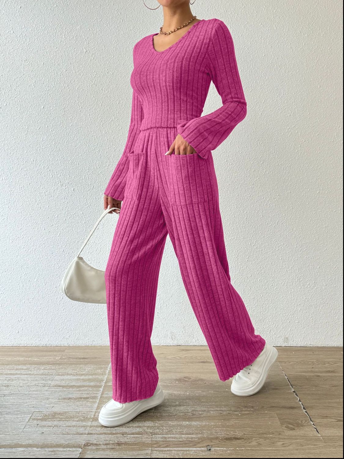 Hot Pink ribbed knit loungewear set with v-neck top and wide leg pants with pockets.