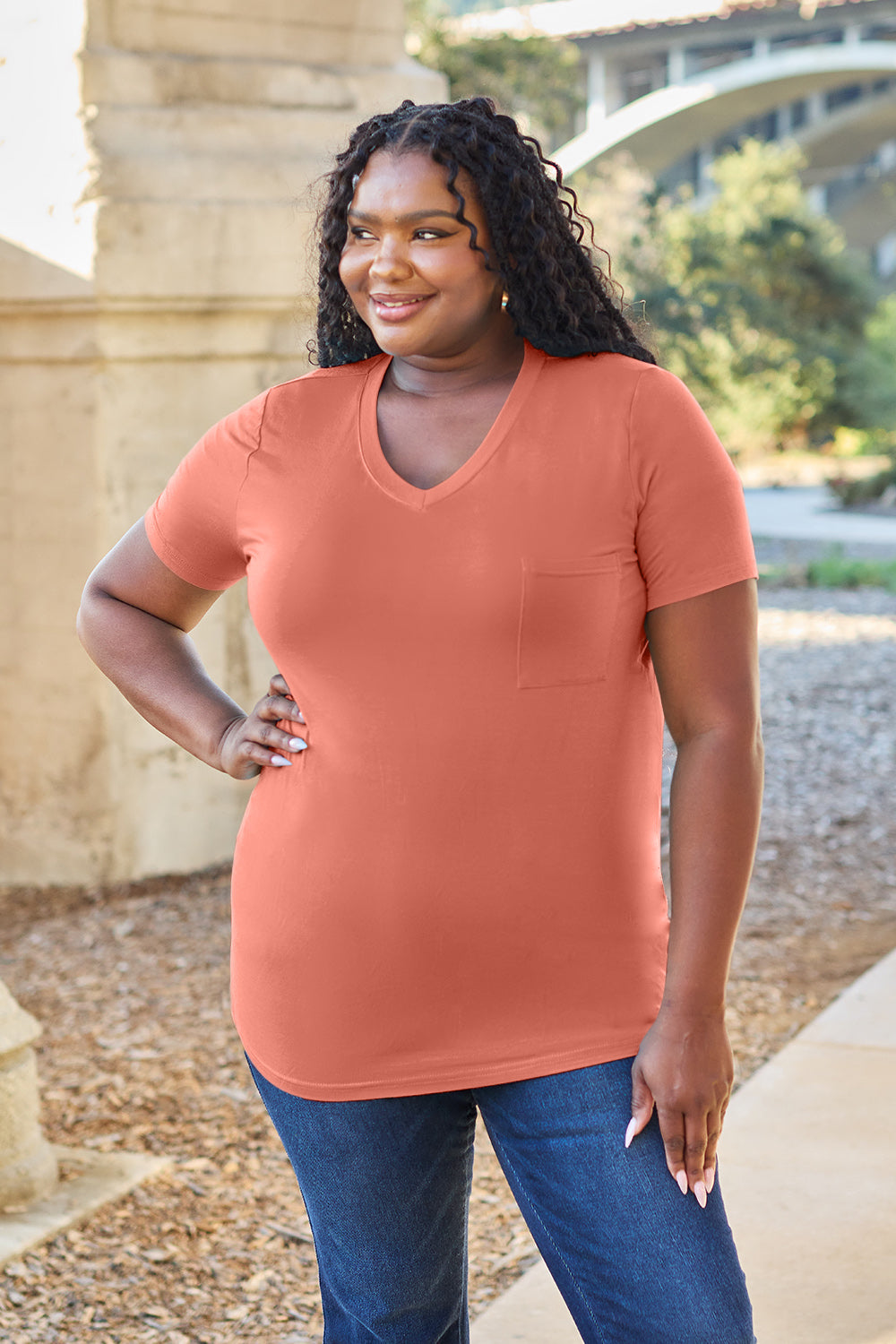 V-neck pocket tee in watermelon pink with short sleeves and a relaxed fit.
