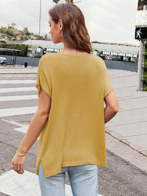 Mustard knit tee with cap sleeves, slit hem, and a wide neckline.