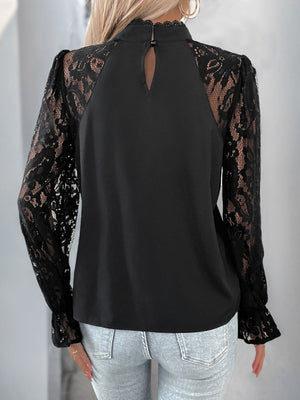 Black lace sleeve blouse with mock neck and keyhole back detail.