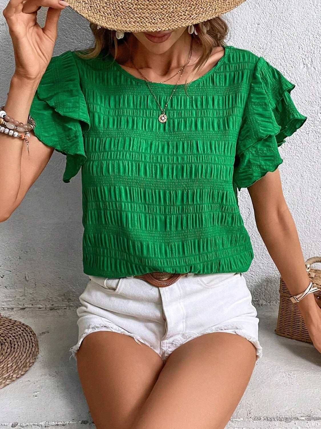 Green textured smocked blouse with ruffle sleeves