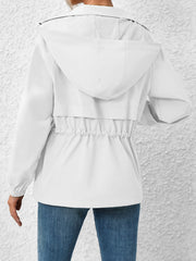 White hooded utility jacket with cinched waist detail and elastic cuffs.