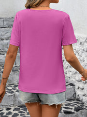 Fuchsia pink jersey top with puffed short sleeves and a crew neck.
