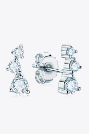 Silver cluster stud earrings with three round moissanite stones in an ascending design.