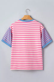 Polyester short sleeve tee with pink, white, and blue horizontal stripes and contrast blue sleeves.