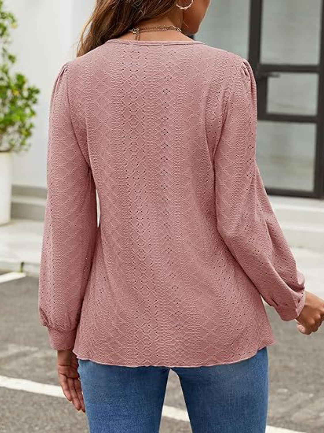 Perforated puff sleeve blouse in dusty pink with allover diamond pattern.