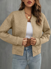 Camel diamond quilted bomber jacket with zip closure and ribbed cuffs.