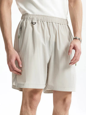 Light gray men's bermuda shorts with elastic waist, d-ring, and zippered pocket.